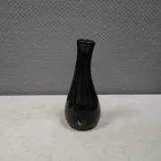 A unique vase in hand-blown glass with a hint of purple in the colour.