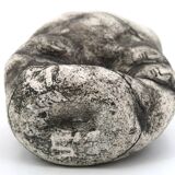 Ceramic vase sculpture decorated with faces and featuring a hole, 1980s.