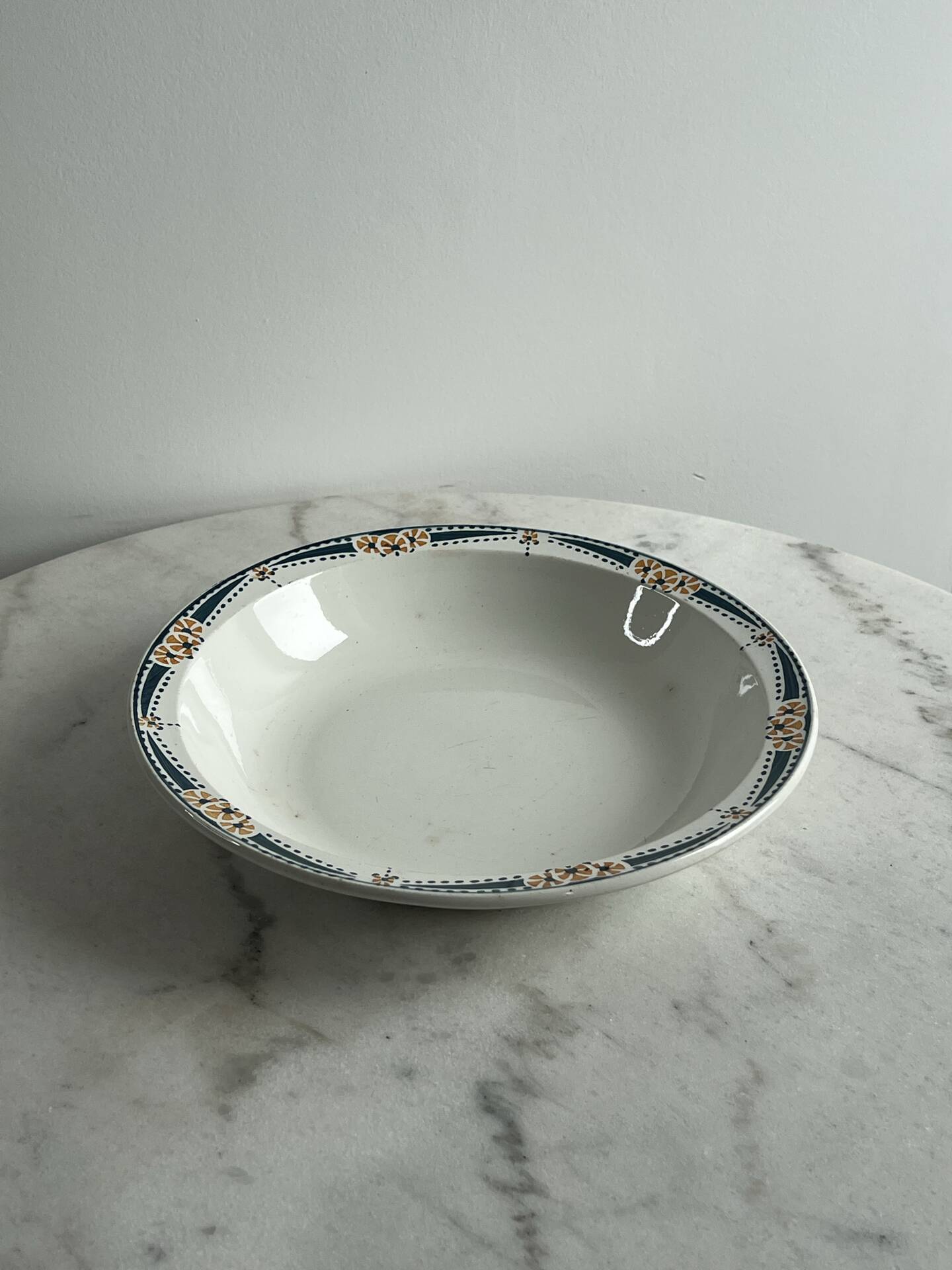 Longwy salad bowl with blue and orange floral decoration.