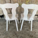 Pair of vintage white wooden bistro chairs