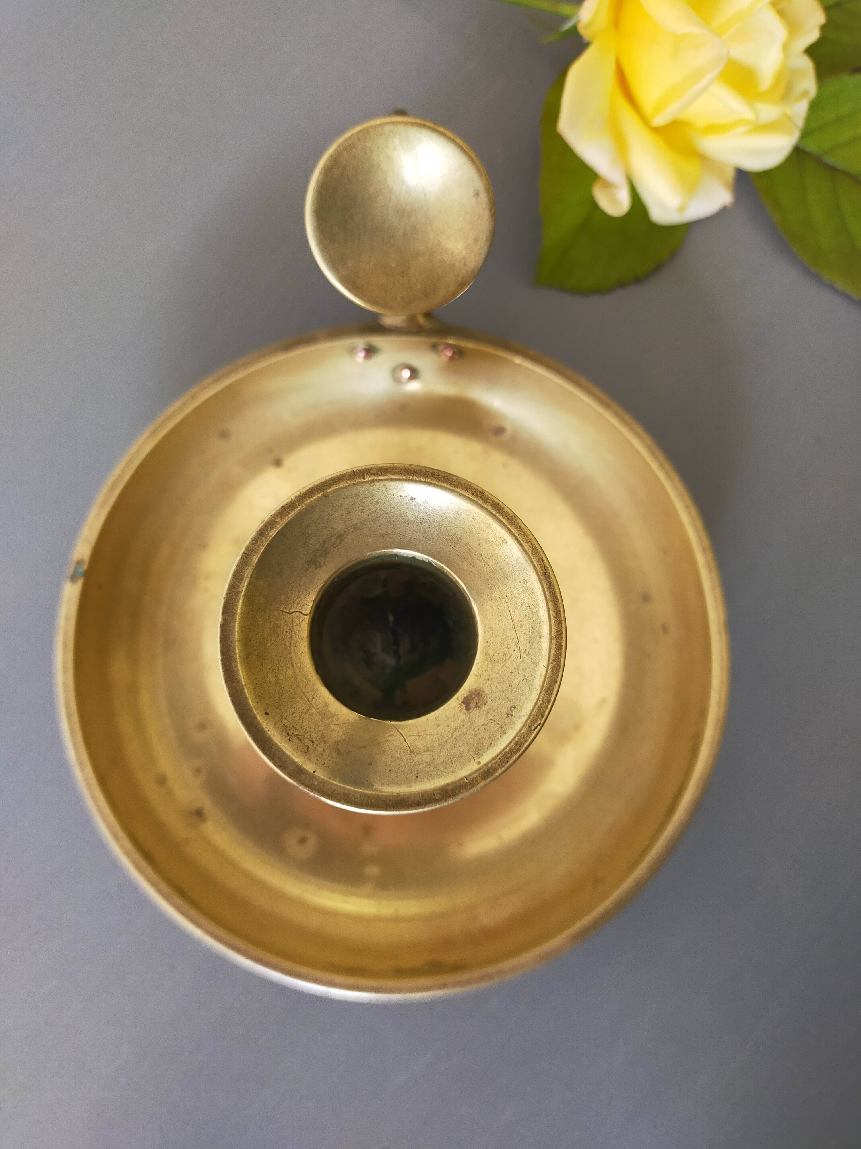 brass candle holder with old cellar rat thumb