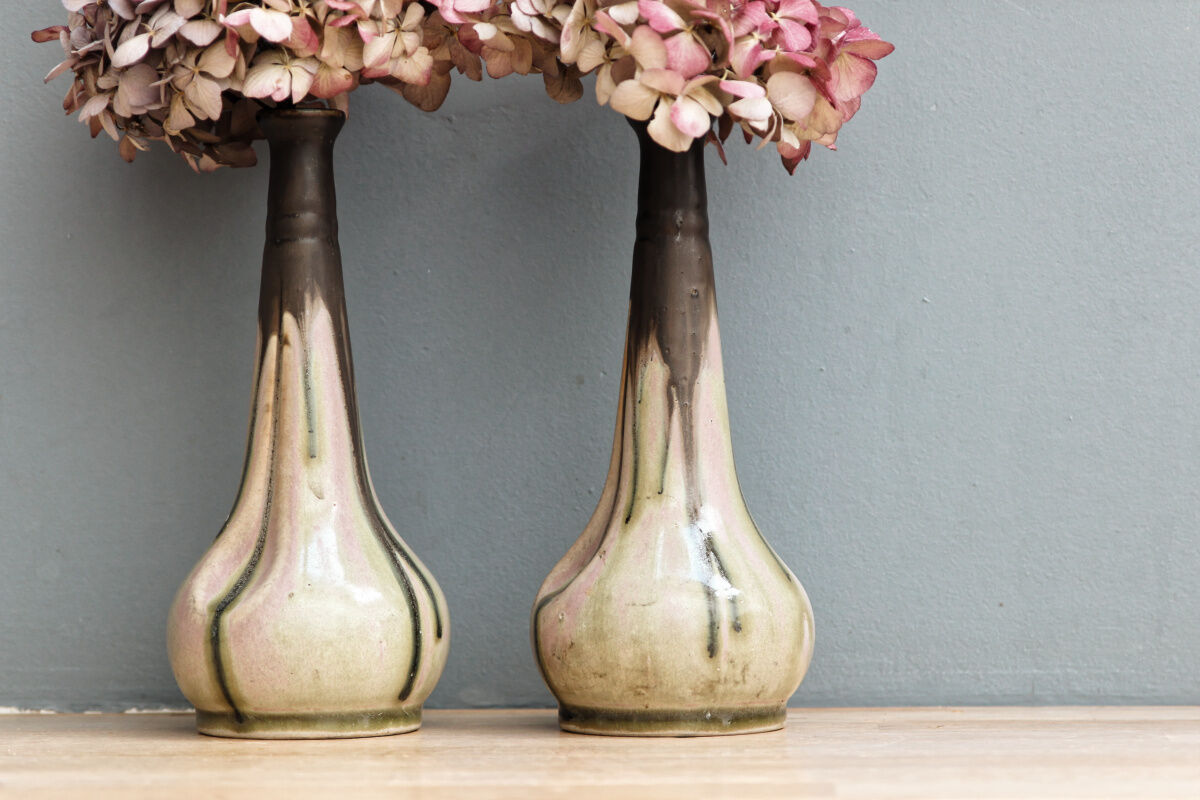 Pair of glazed sizzlings, signed