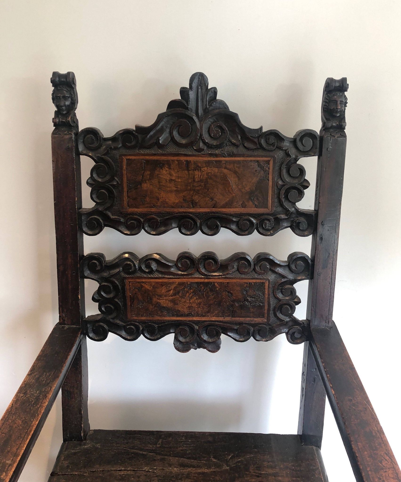 Set of an armchair and a pair of chairs in Italian Renaissance walnut