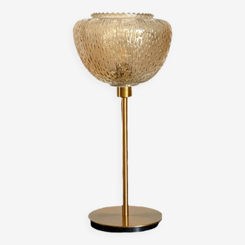 Table lamp with a vintage globe lampshade in gold glass