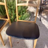 5 Scandinavian style chairs, wood and black faux leather.