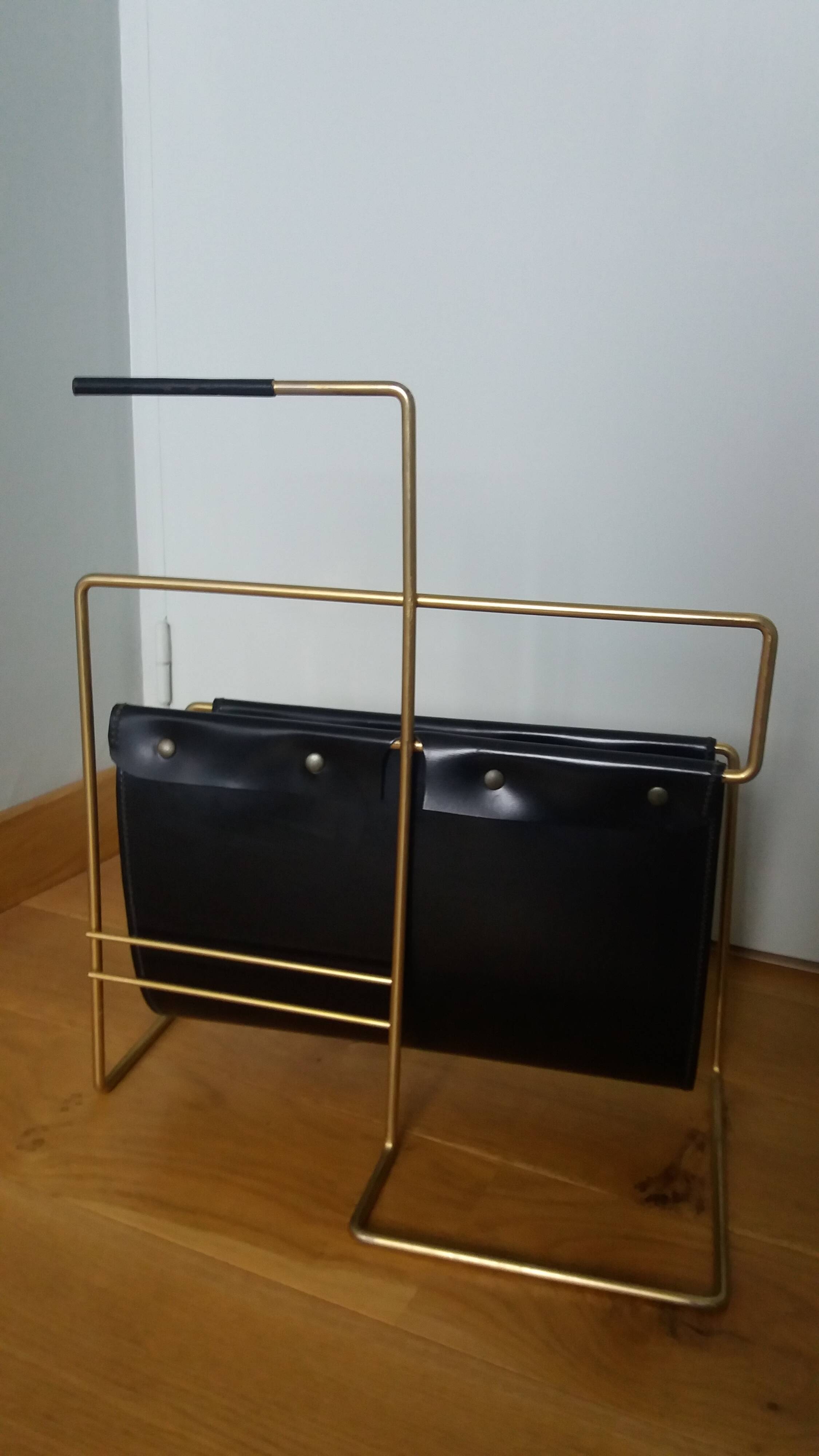 Modernist magazine rack in the style of Jacques Adnet