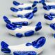 Set of 11 vintage blue and white porcelain fish knife rests.