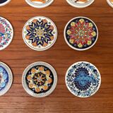 Set of 13 vintage ceramic coasters handmade by Lito Niarchos.