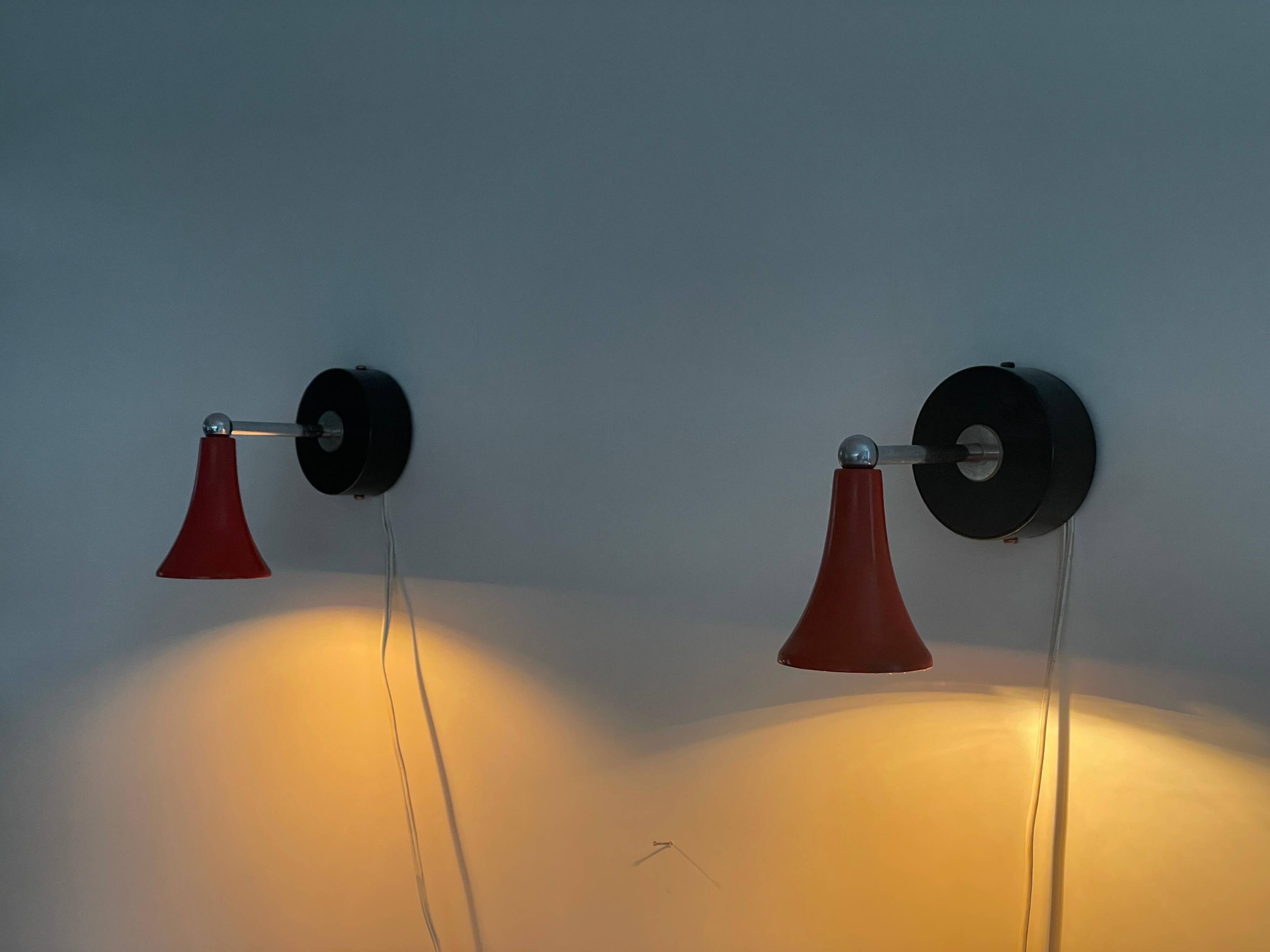 Pair of red metal wall lights AGE, 1970s, Italy