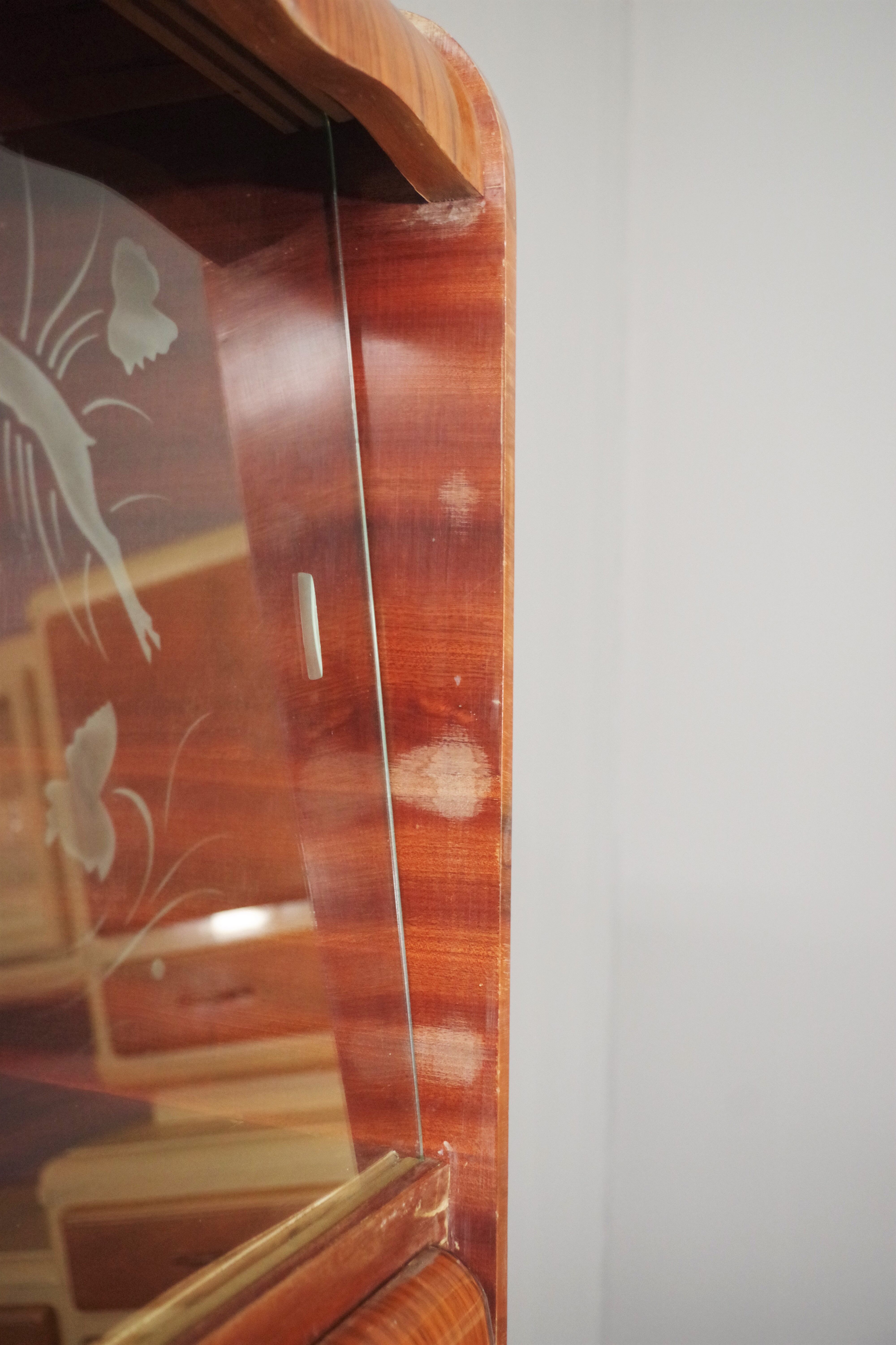 Rounded furniture from the 1950s in cherry veneer