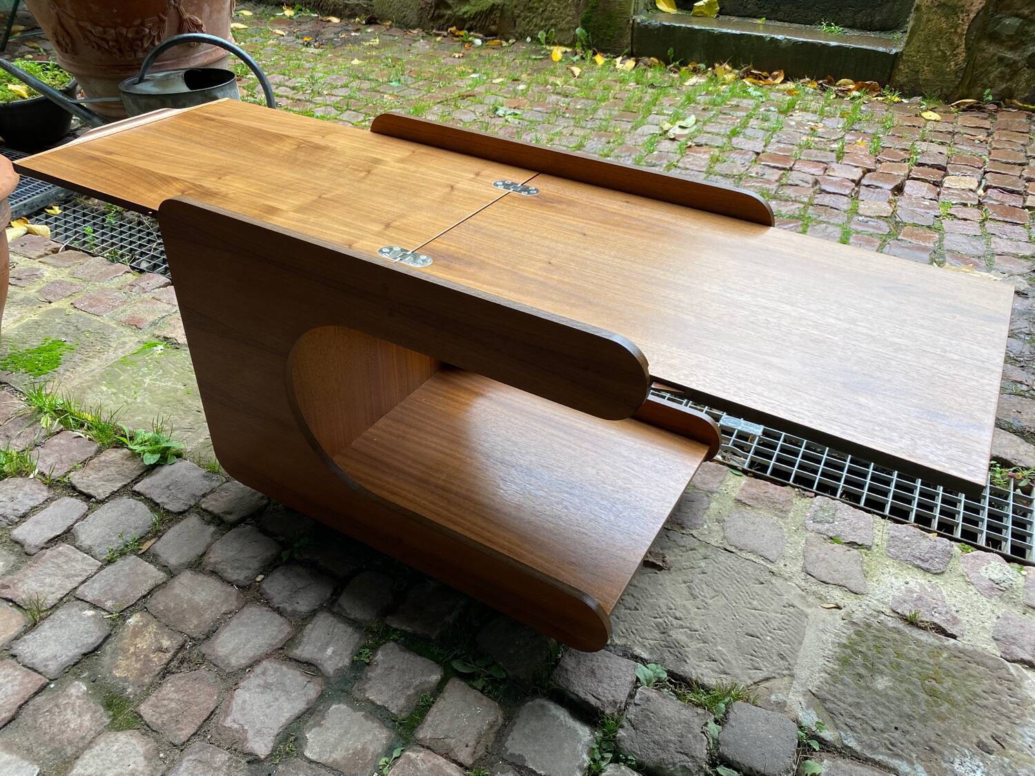 Rolling teak coffee table with foldable top circa 1960