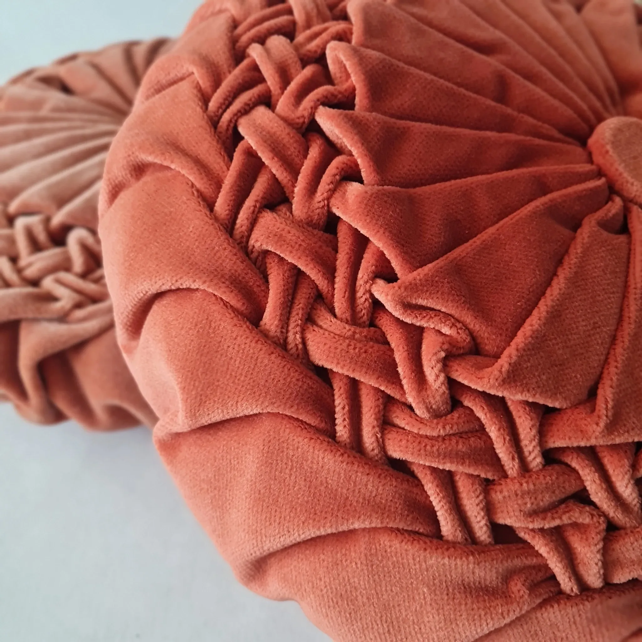Pleated terracotta red velvet cushion