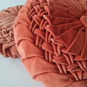 Pleated terracotta red velvet cushion
