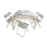 Plia' chairs by Giancarlo Piretti for Castelli with a table