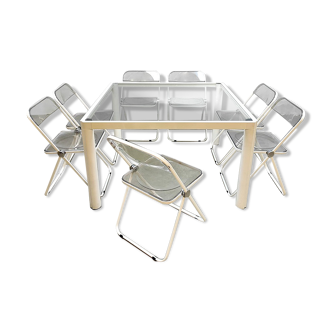 Plia' chairs by Giancarlo Piretti for Castelli with a table