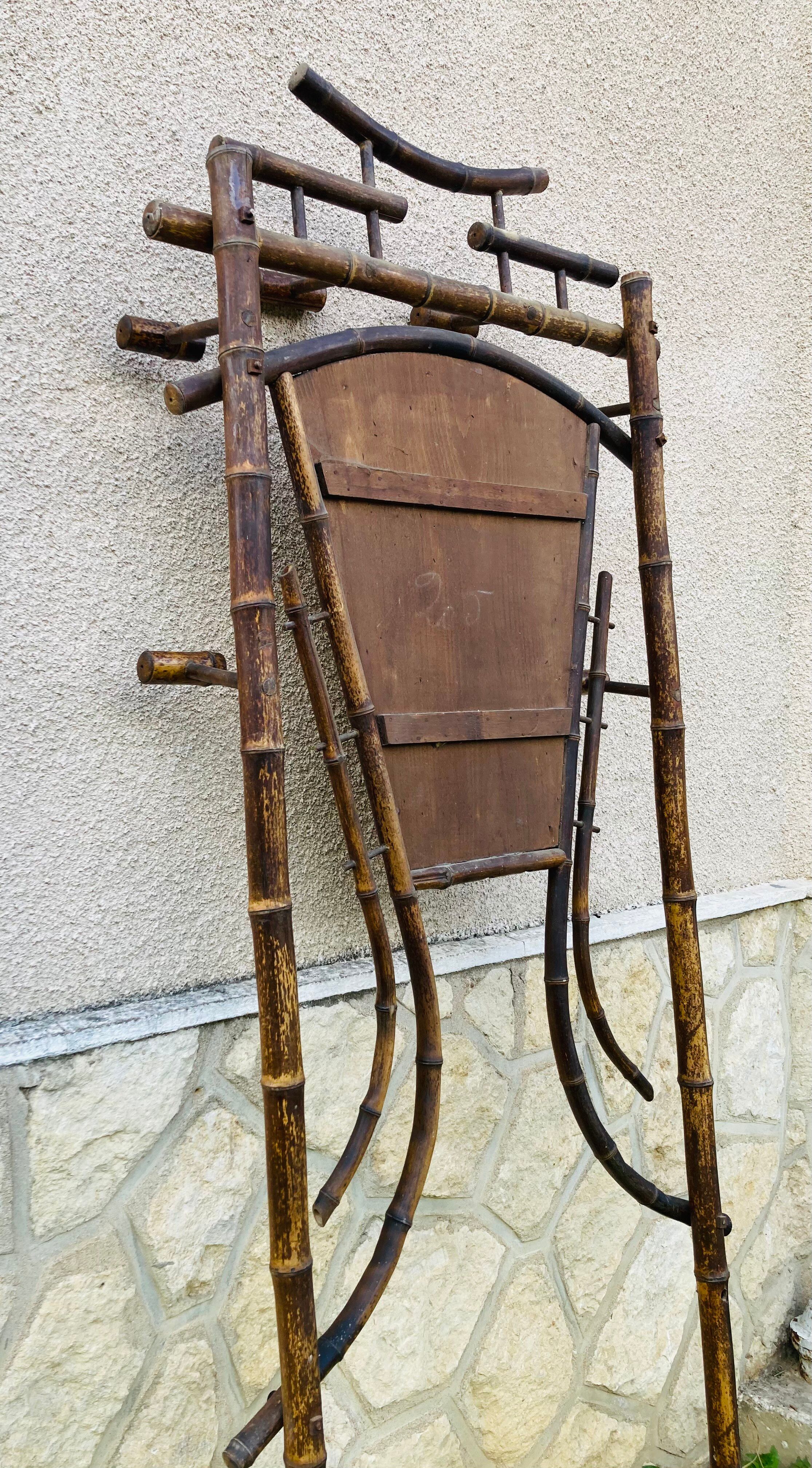 Bamboo coat rack from the 19th century, mirror in the shape of a crescent moon.