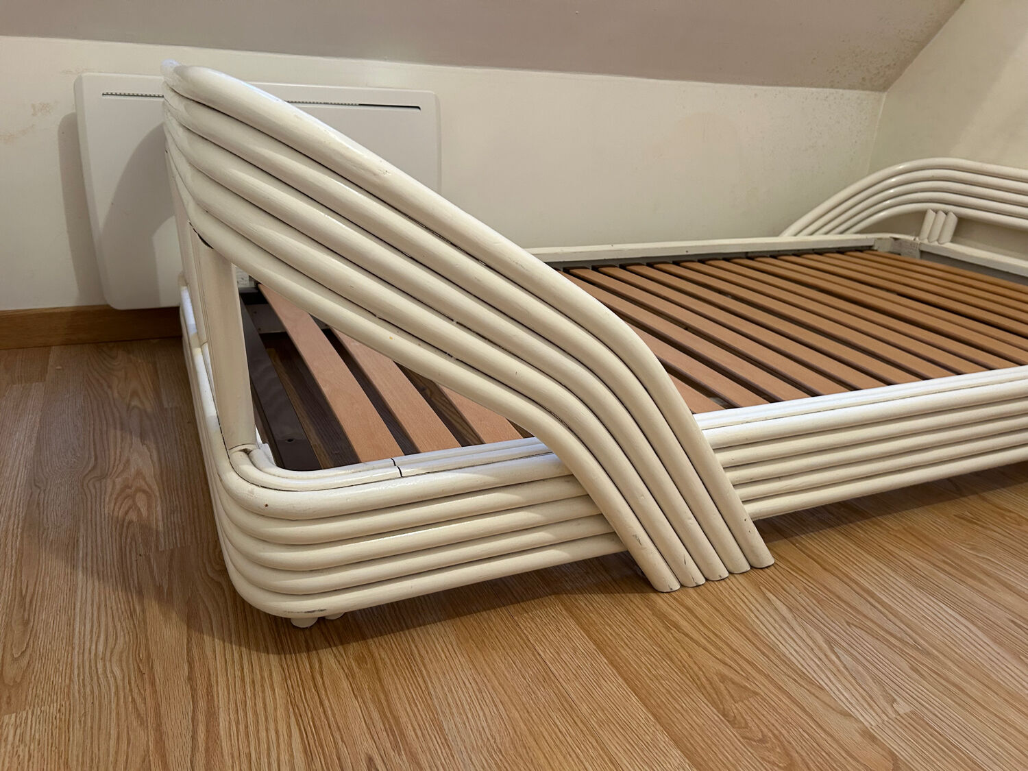 Vintage white rattan bed from the 1960s.