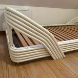 Vintage white rattan bed from the 1960s.
