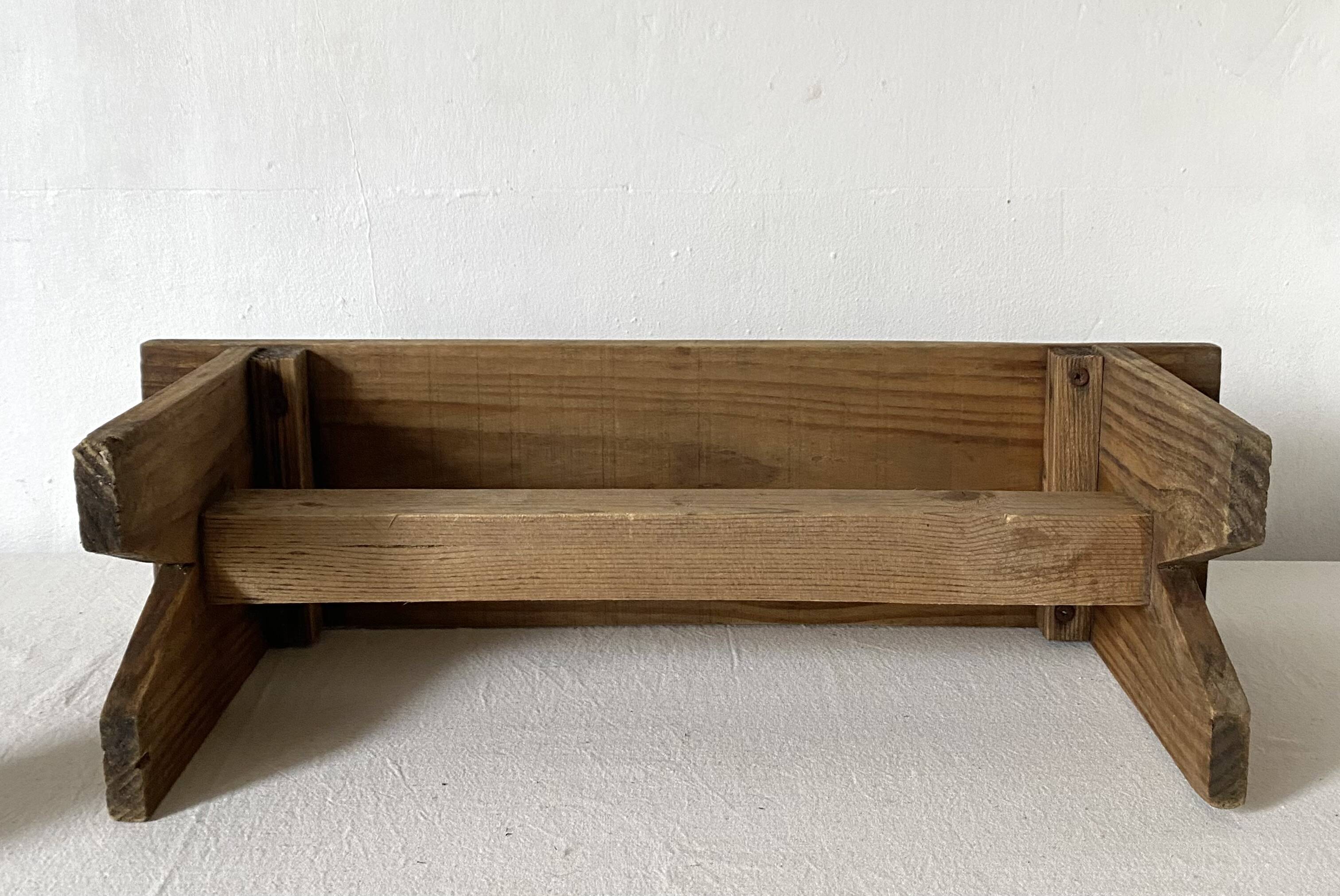 Low stool in raw wood