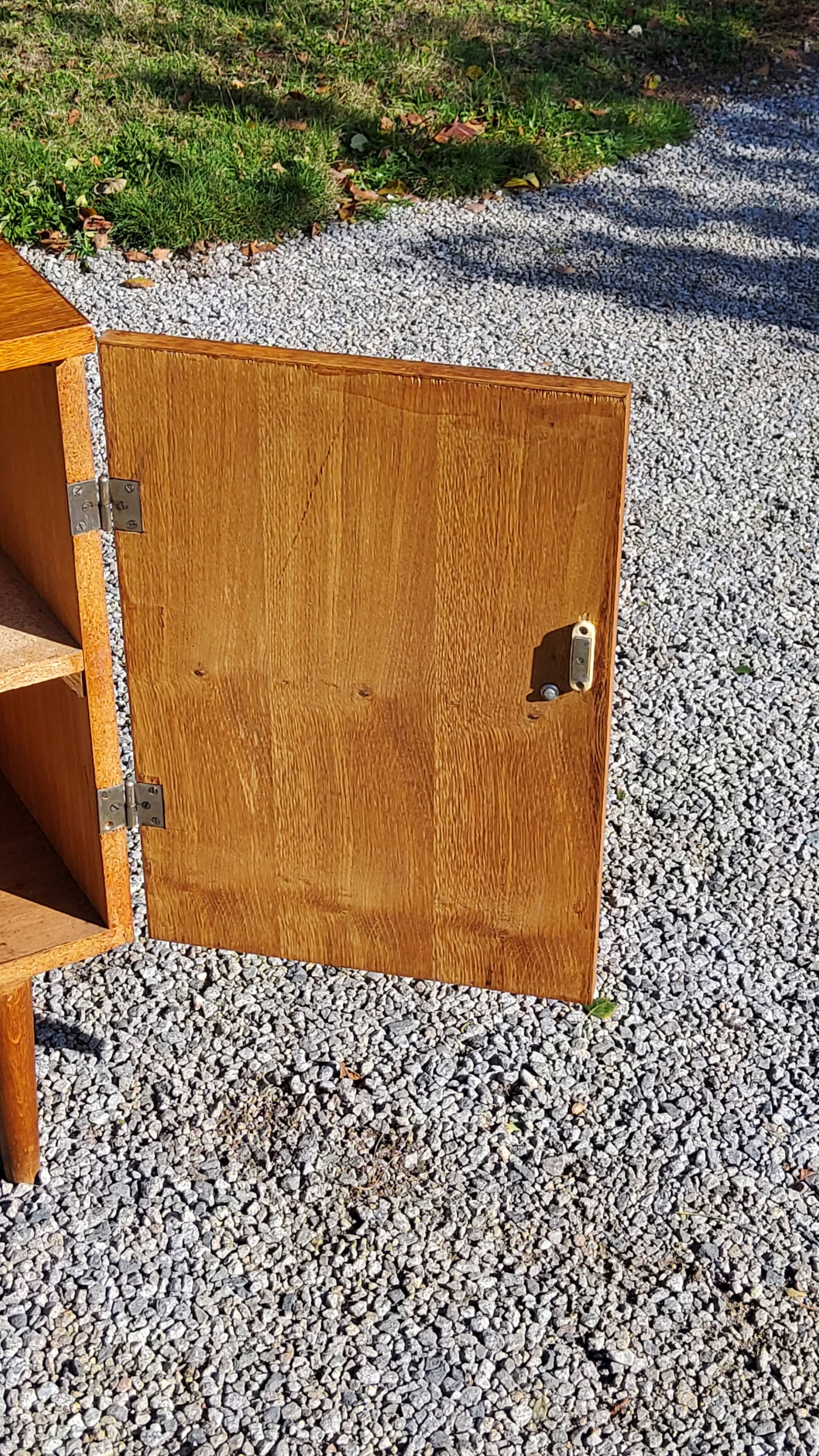 Vintage golden oak sideboard with conical legs from the 1950s