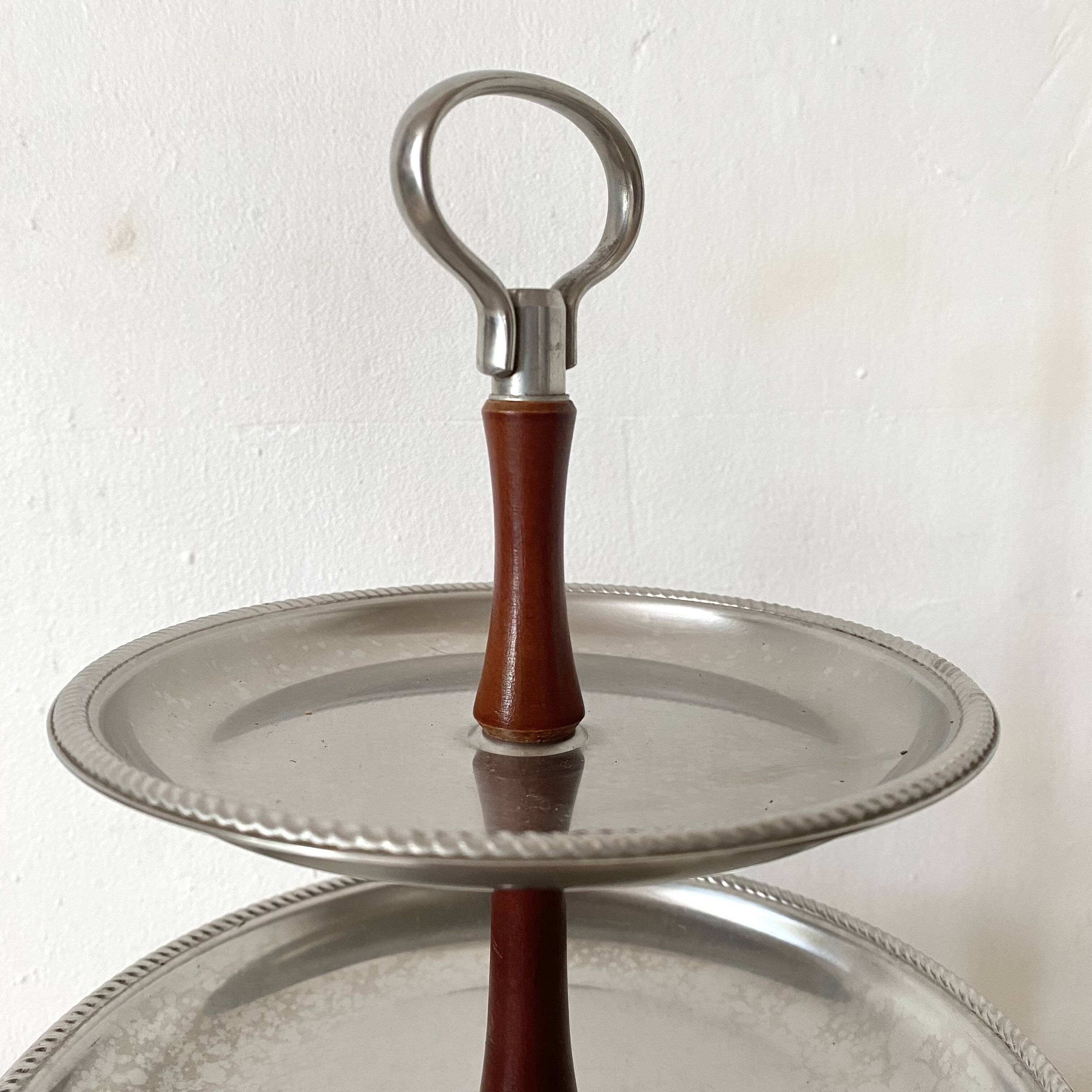 Vintage tiered display stand, stainless steel rotating server Alessi Fratelli