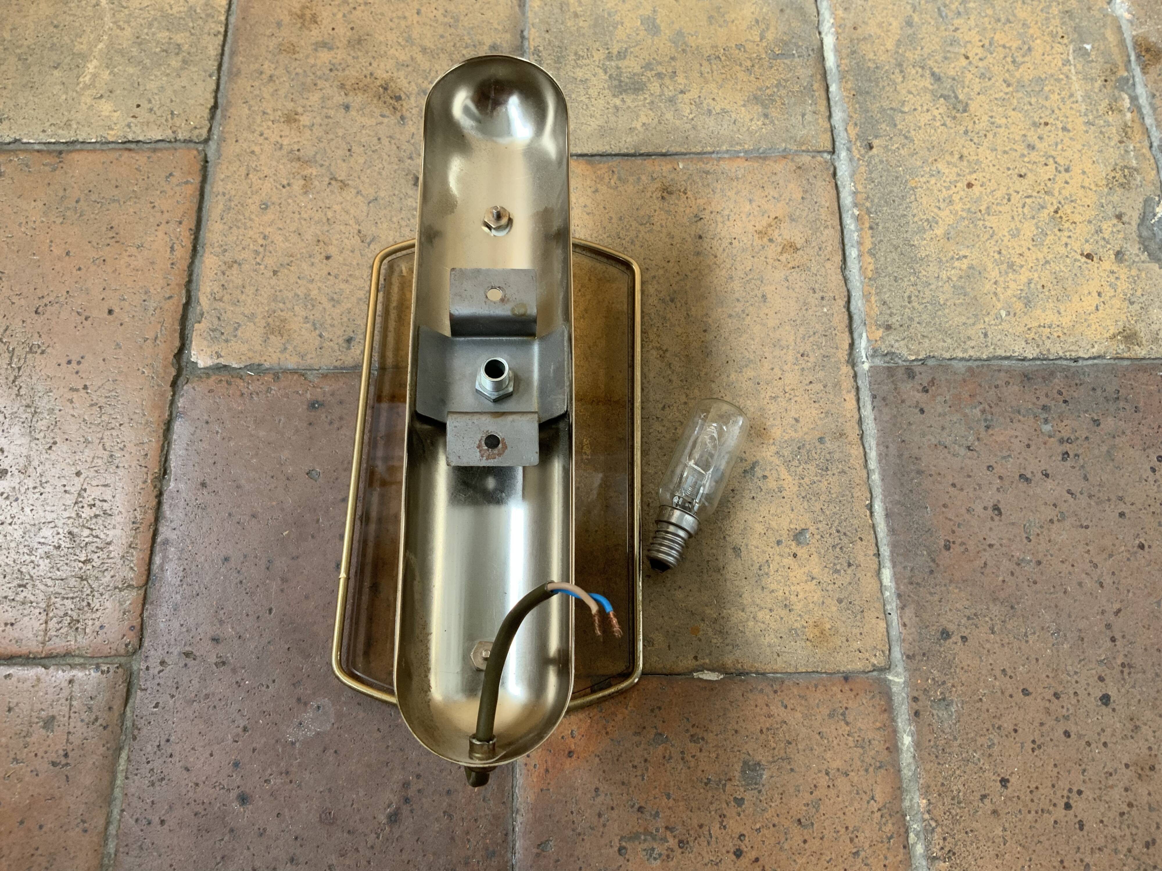 Brass wall lamp and smoked glass