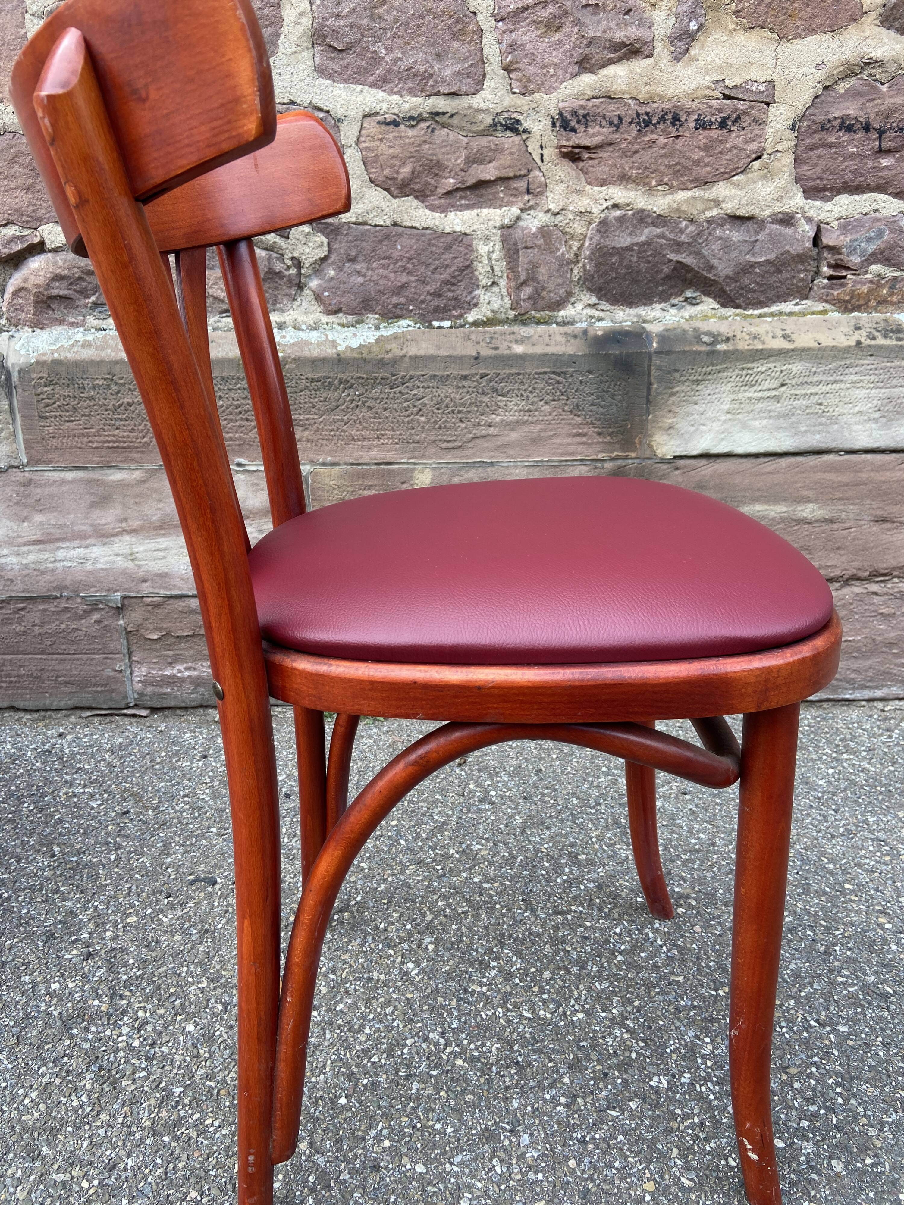 Pair of Alsatian bistro chairs in wood and leather, 1960