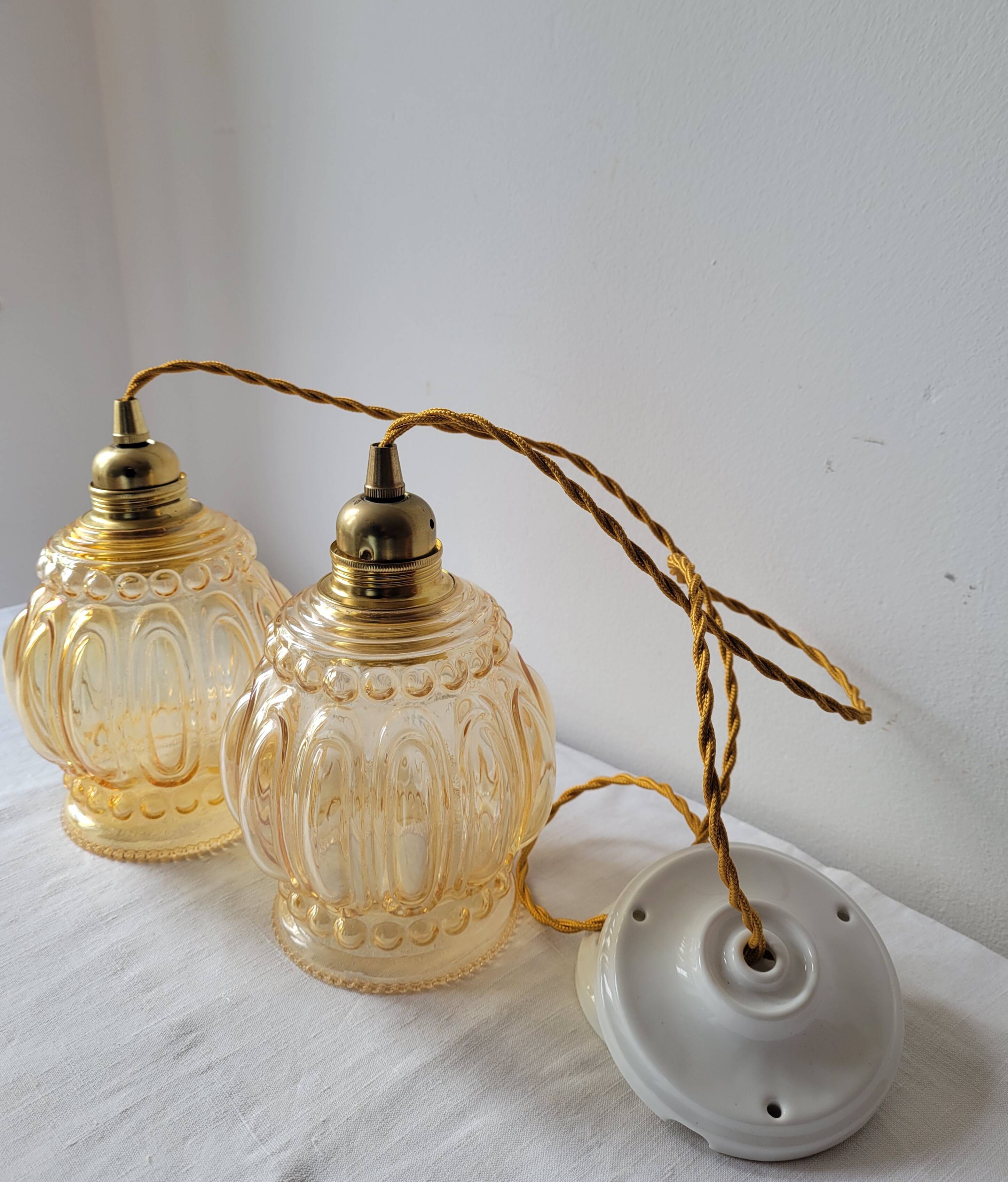 Duo of amber molded glass pendant lights