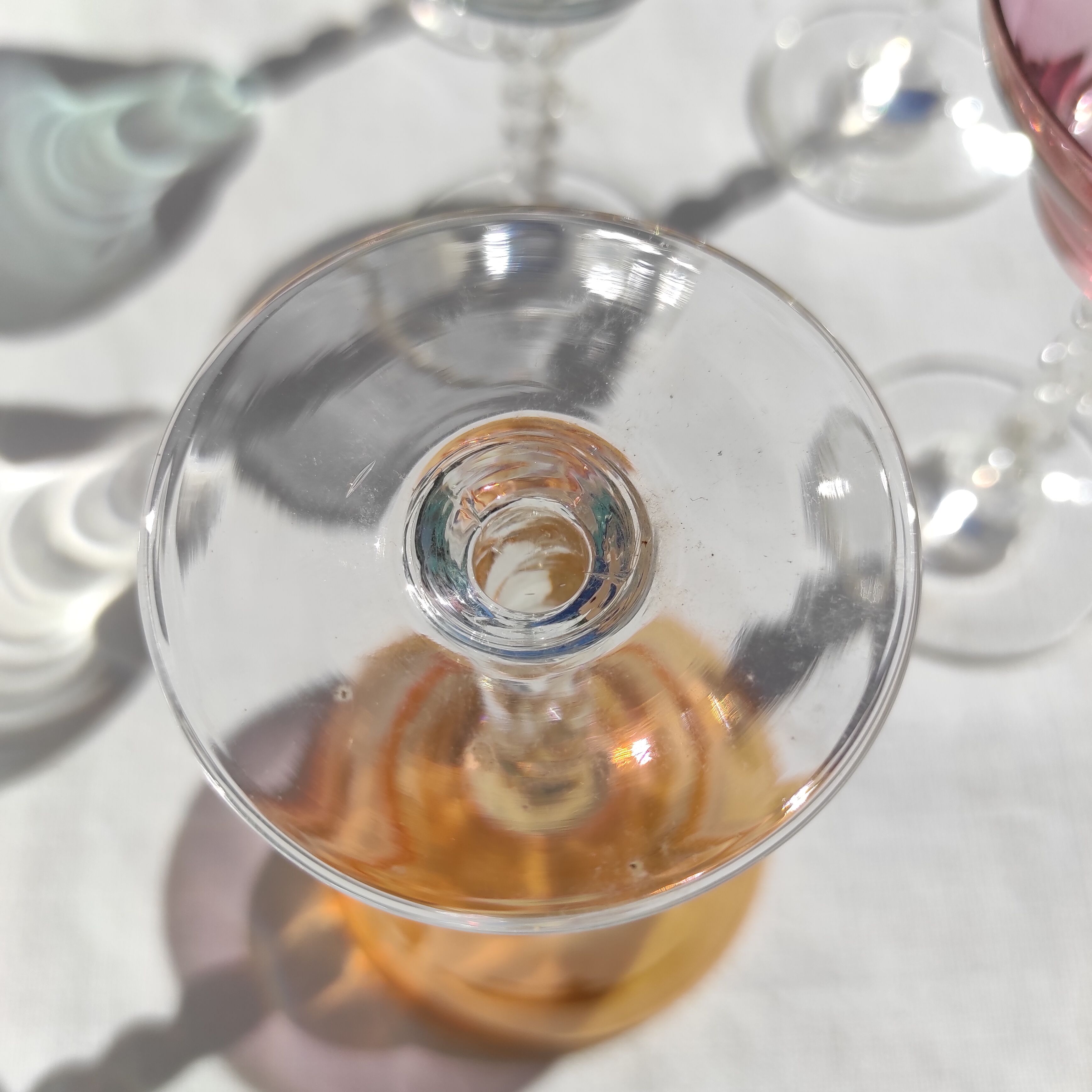 Twisted foot glasses of different color