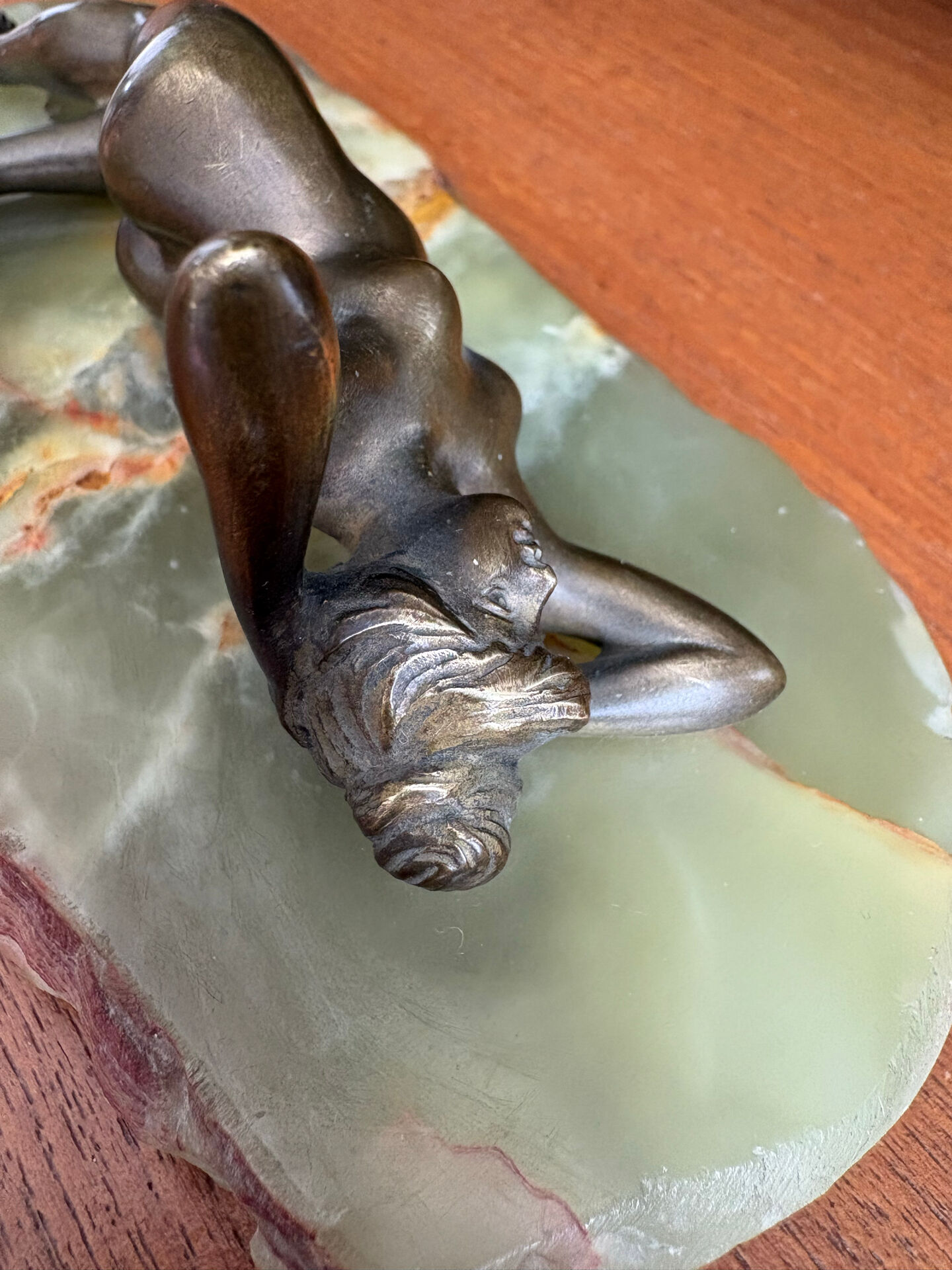 Art Deco female sculpture in bronze with onyx base.