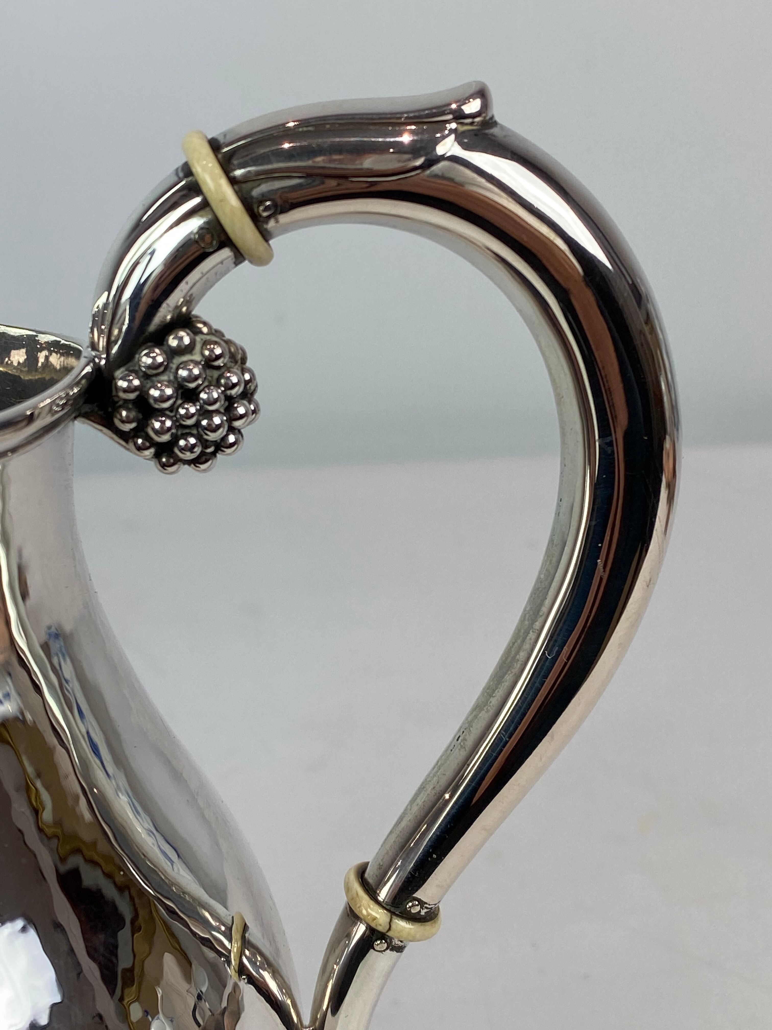 Water jug on feet decorated with ebony of hallmarked silver from the 1940s. The jug is in great anti