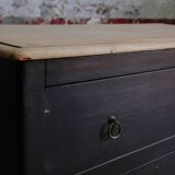 Commode noire à 2 tiroirs, plateau en bois brut et pied fuselés