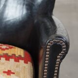 Subtle black armchair with reversible Kelim seat cushion