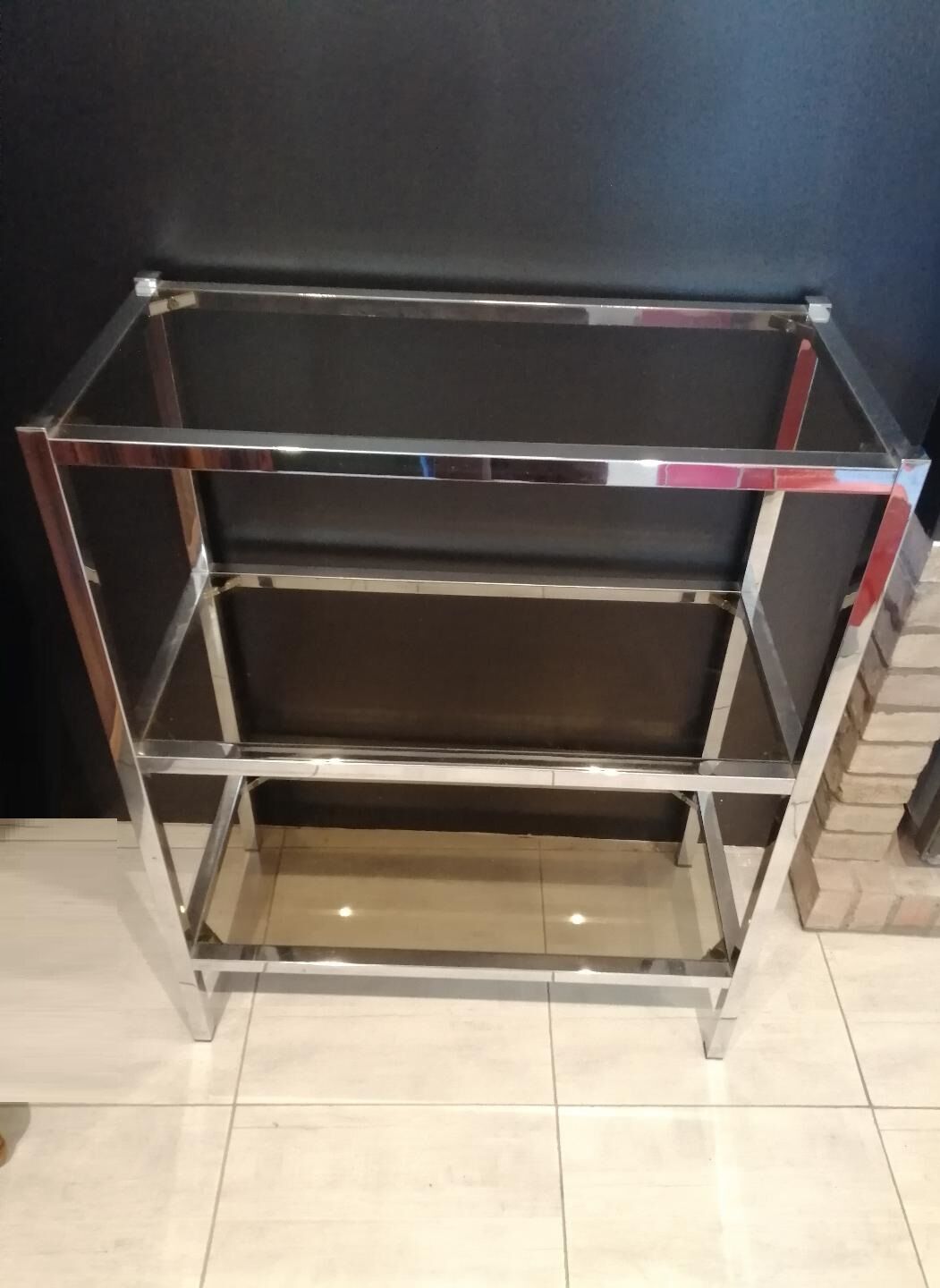 Shelf 70s chrome and smoked glass.