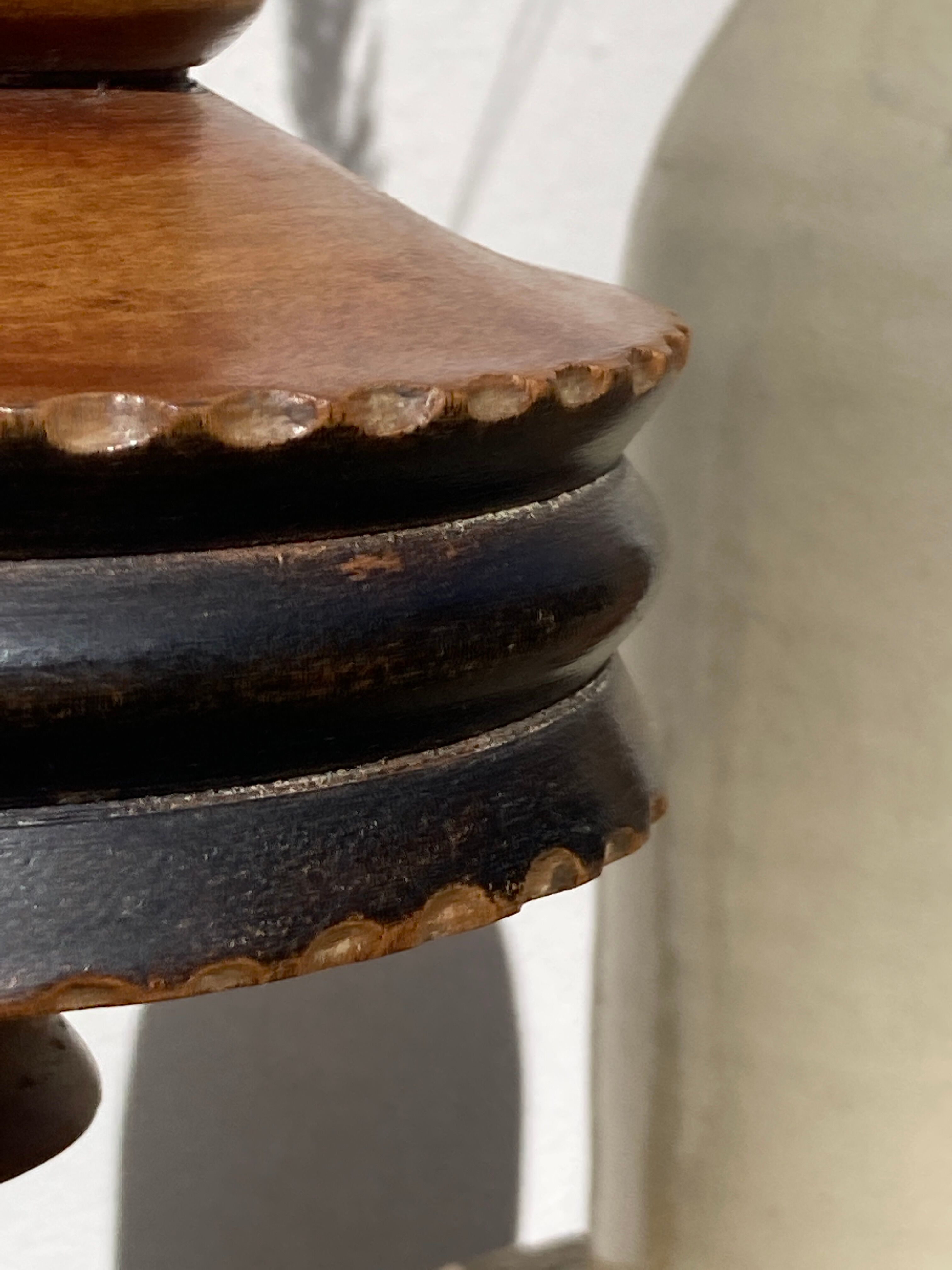 Foot of turned wooden lamp and carved