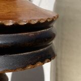 Foot of turned wooden lamp and carved