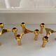 Series of 3 gold Nagel modular candlesticks