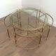 Round brass coffee table in neoclassical style