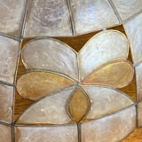 Mother-of-pearl and brass pendant with floral decoration.