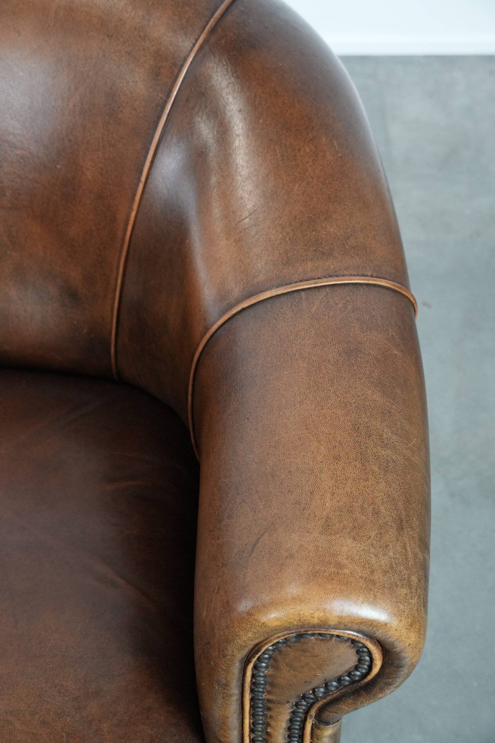 Characterful vintage sturdy 2-seater club sofa made of sheepskin leather