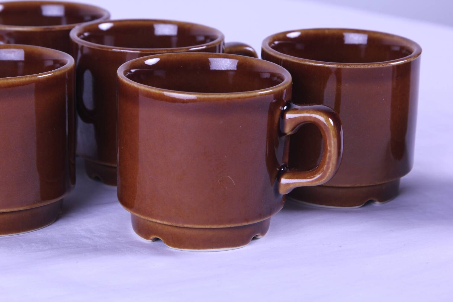 6 brown stackable coffee cups