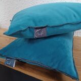 Set of 2 turquoise blue velvet cushions with black overlock finish