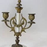 Clock and pair of Louis XVI style candelabras.