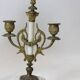 Clock and pair of Louis XVI style candelabras.