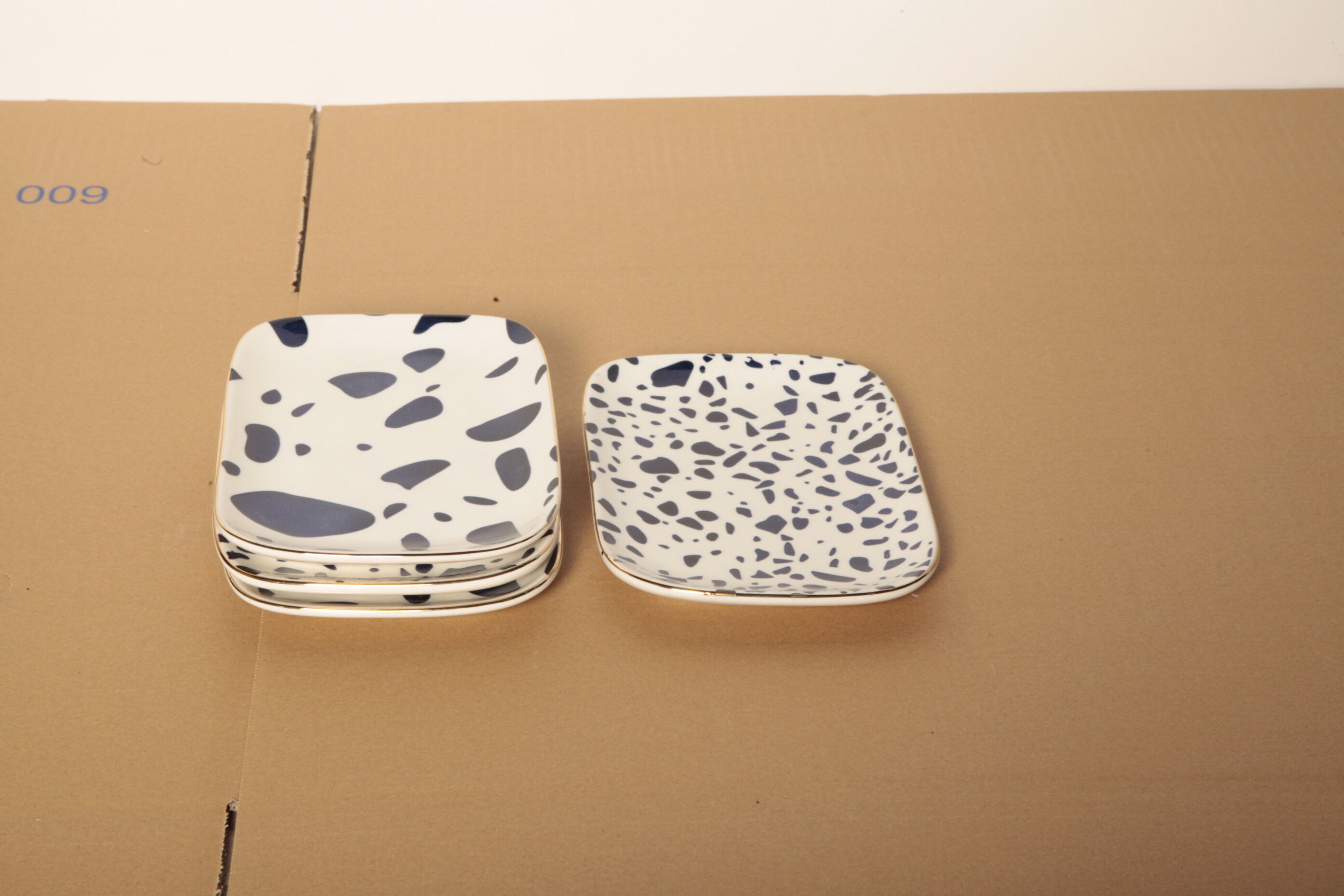4 dishes blue terrazzo patterns
