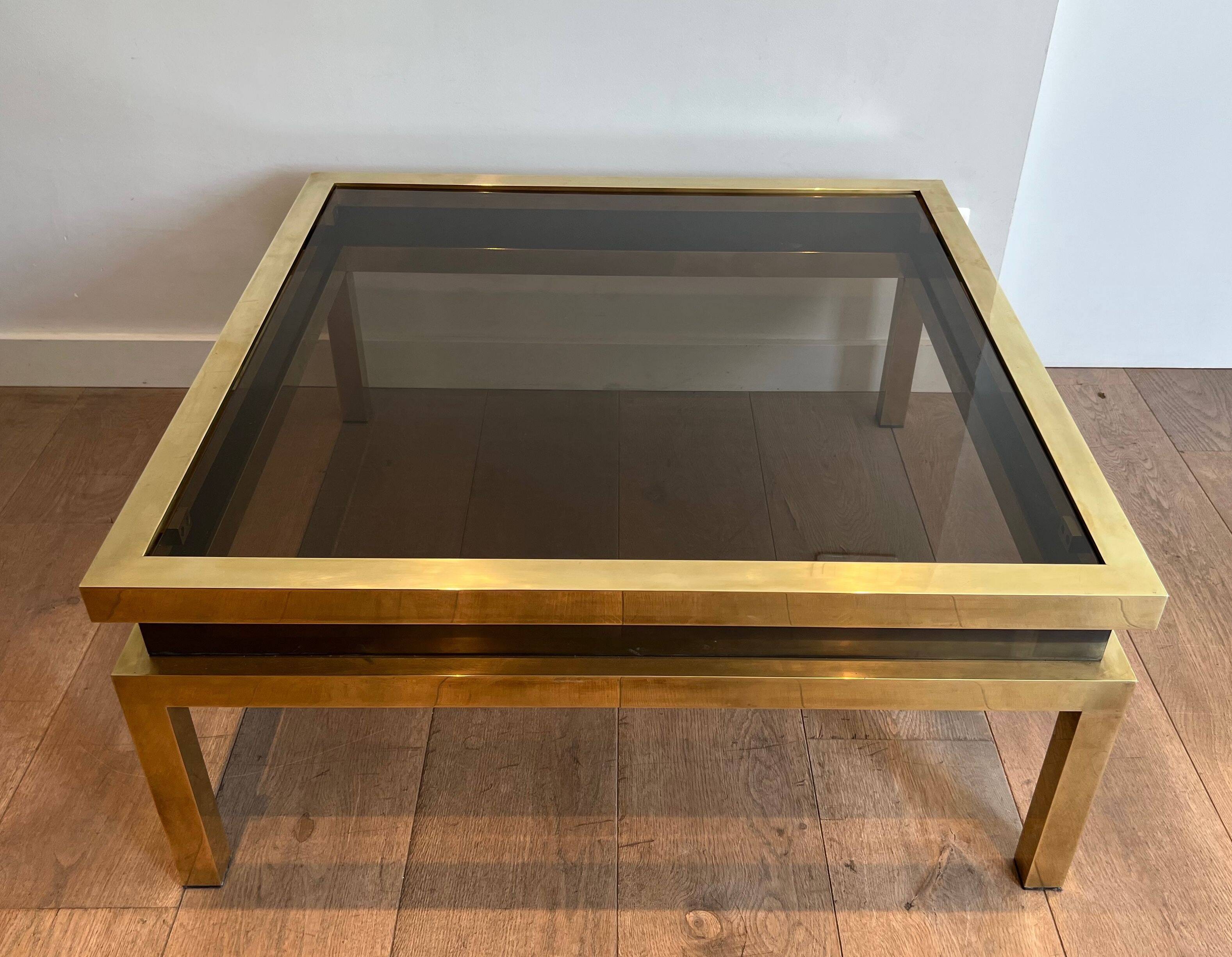 Coffee table in brass and black lacquer by Guy Lefèvre for Maison Jansen