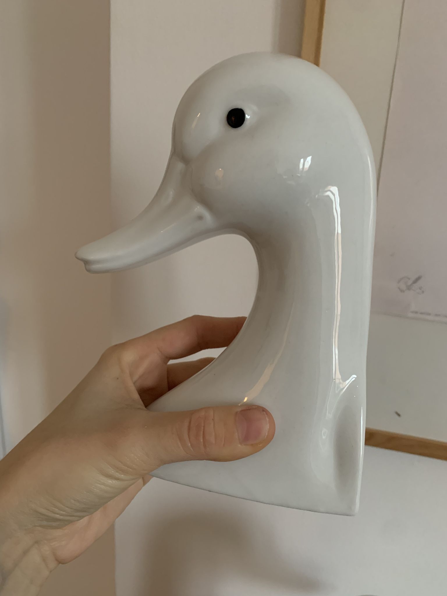 Vintage bookends in the shape of a goose or ceramic duck