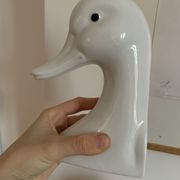 Vintage bookends in the shape of a goose or ceramic duck