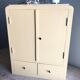 Weathered toilet cabinet