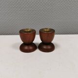 Two beautiful teak candle holders with brass inserts.
